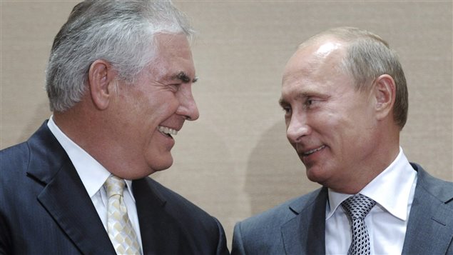 In this Aug. 30, 2011, file photo, then Russian Prime Minister Vladimir Putin, right, and Rex Tillerson, then ExxonMobil’s chief executive, smile during a signing ceremony in the Black Sea resort of Sochi, Russia.