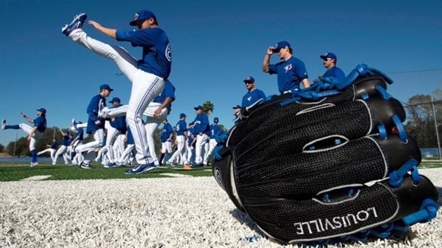 Toronto Blue Jays pitchers limber up at Spring Training in Dunedin, Fla. in 2014. They'll be doing the same thing on Wednesday. 