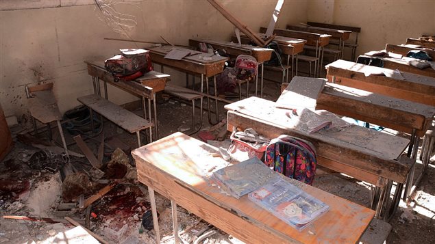 An image shows a pool of blood and damage at a classroom after it was reportedly hit by rebel rocket fire in the Furqan neighbourhood of the government-held side of west Aleppo, on November 20, 2016. At least seven children were killed by rebel rocket fire that hit a school in the government-held west of Aleppo city, state media said.