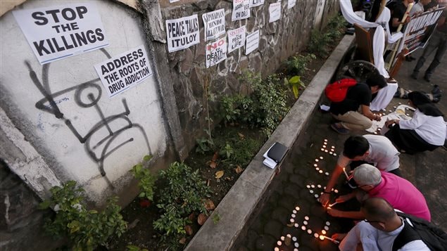 Priests and nuns attend a prayer-vigil to protest the unrelenting killings in the so-called war on drugs waged by Philippine President Rodrigo Duterte.