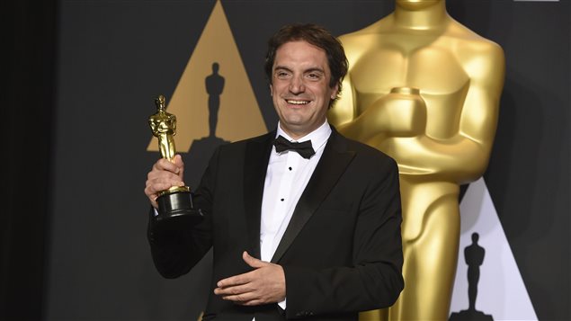 Sylvain Bellemare poses with the Oscar he won for sound editing on the film “Arrival.”
