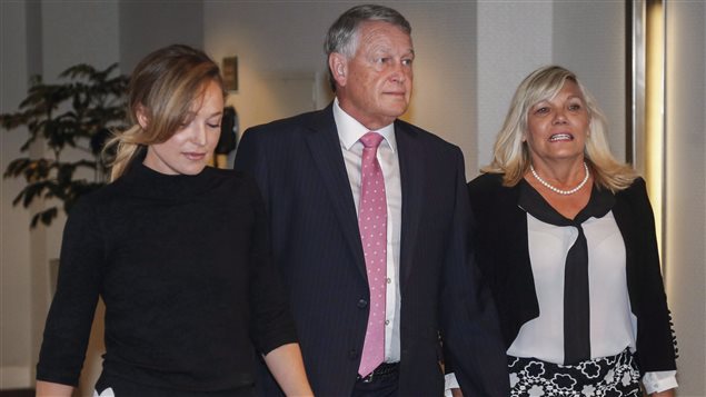 Then-Federal Court Justice Robin Camp arrives with his wife Mariaan, right, and daughter Lauren at a Canadian Judicial Council inquiry in Calgary in September of last year. Camp resigned his seat on the bench on Thursday.