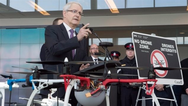 Transport Minister Marc Garneau announces new safety restrictions on recreational drones at Billy Bishop airport in Toronto on Thursday. 