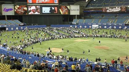 Fans fill the outfield at Olympic Stadium prior to the Expos' final game on Sept. 29, 2004, against Florida. Many remain optimistic that Major League Baseball may soon return to Montreal and the fever climbed again this week based on a media report that went viral.