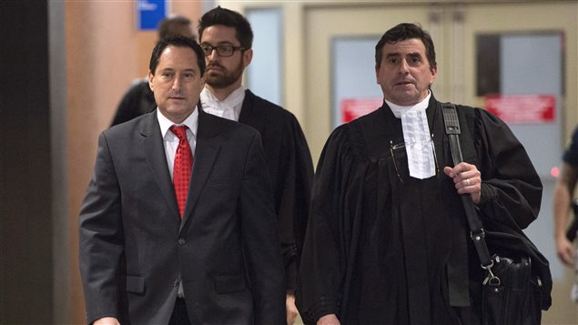 Former Montreal mayor Michael Applebaum, left, leaves a courtroom with his lawyer Pierre Teasdale in January after being found guilty  of eight of the 14 corruption-related charges against. He was sentenced Thursday to a year in prison and two years of probation. 