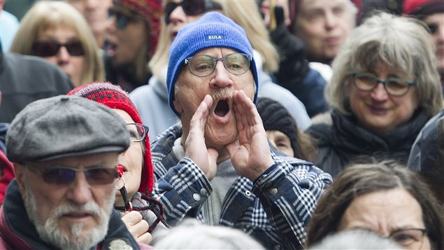 Protesters voiced their anger over executive pay hikes outside Bombardier’s Montreal headquarters.