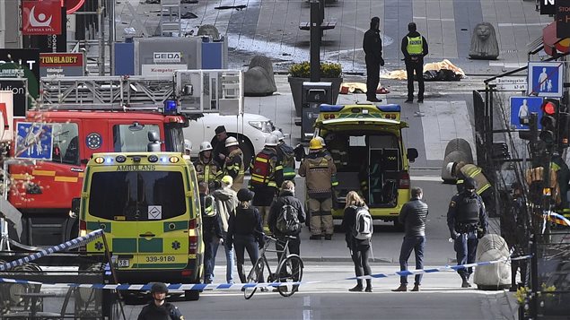 A view of the scene as emergency services work in the area after a truck crashed into a department store injuring several people in central Stockholm, Sweden, Friday April 7, 2017.