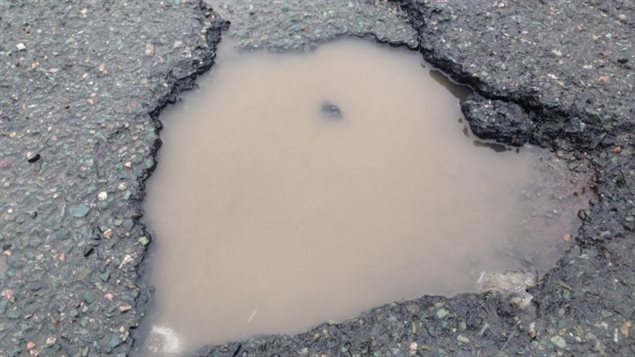 metimes potholes fill with water making them harder to see and avoid.