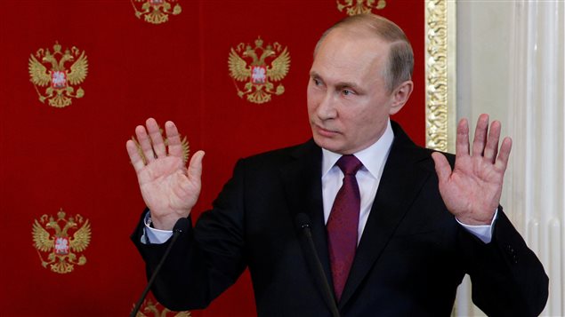 Russian President Vladimir Putin gestures during a joint news conference with Italian President Sergio Mattarella after their talks at the Kremlin in Moscow, Russia, April 11, 2017.