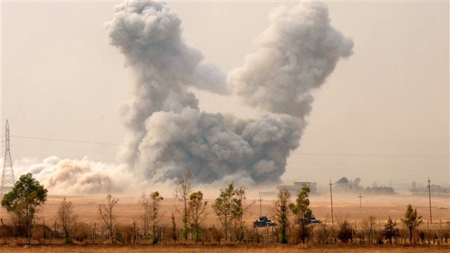 Smoke rises after an U.S. airstrike, while the Iraqi army pushes into Topzawa village during the operation against Islamic State militants near Bashiqa, near Mosul, Iraq October 24, 2016.