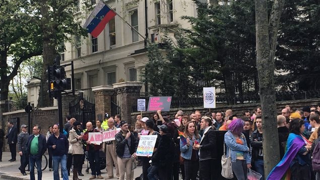 People protest outside the Russian Embassy in London last Wednesday following reports of the torture and murder of gay men in Chechnya. Canada is calling on Russian President Vladimir Putin to investigate the reported persecution.