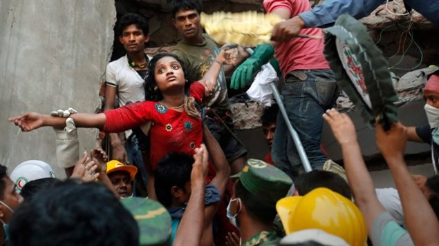 People rushed to pull workers out of the collapsed Rana Plaza factory in Bangladesh on April 24, 2013.