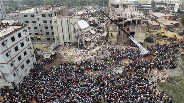 People gathered the day after the disaster as rescuers searched for survivors and victims of the factory collapse.