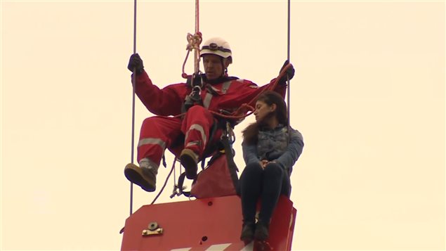 Firefighter Rob Wonfor had to rappel down to the young woman.