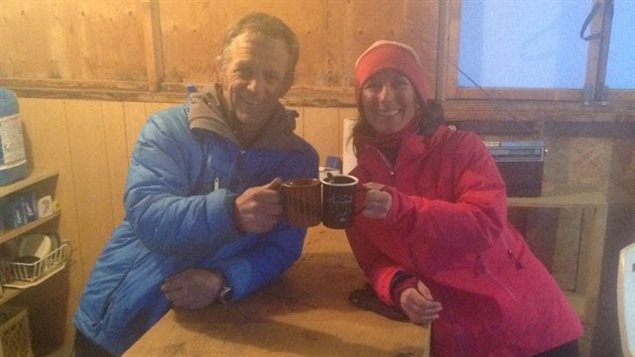 Argentine climber Natilia Martínez celebrates her rescue with Icefield Discovery’s pilot Tom Bradley.