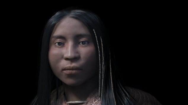 The reconstruction of a shíshálh woman shows beads woven into her hair.