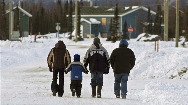 Residents walk in the northern Labrador community of Natuashish, N.L. on Thursday, Dec. 6, 2007. 