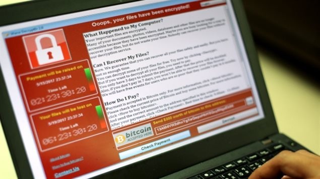 A message from this weekend’s ransomware attack is seen on laptop in Taipei, Taiwan, on Saturday. Companies and government services in dozens of countries were affected by the attack, including the U.K., Germany, China, Japan and South Korea. 