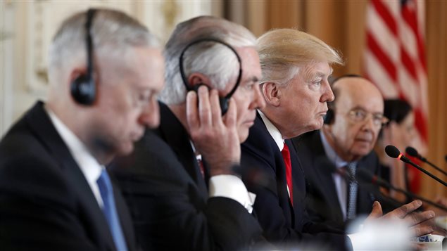 President Donald Trump, joined Defense Secretary Jim Mattis, left, Secretary of State Rex Tillerson, second from left, and Commerce Secretary Wilbur Ross, right, listens as Chinese President Xi Jinping speaks during a bilateral meeting at Mar-a-Lago, Friday, April 7, 2017, in Palm Beach, Fla. 