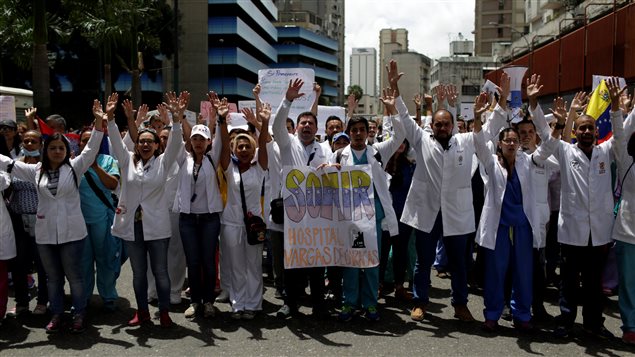 Workers of the health sector and opposition supporters take part in a protest against President Nicolas Maduro’s government in Caracas, Venezuela May 17, 2017.