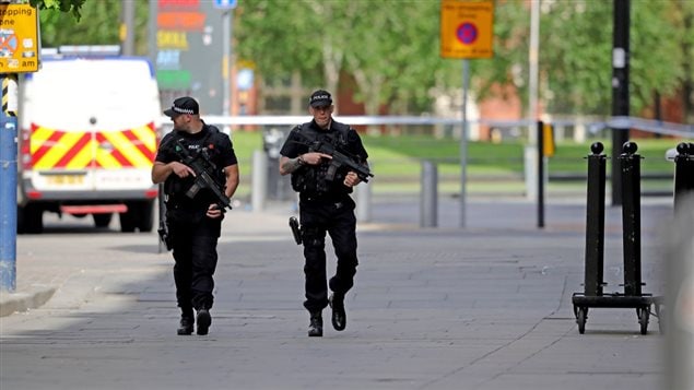 Armed police patrol the streets after last nights terrorist attack, May 23, 2017 in Manchester, England.