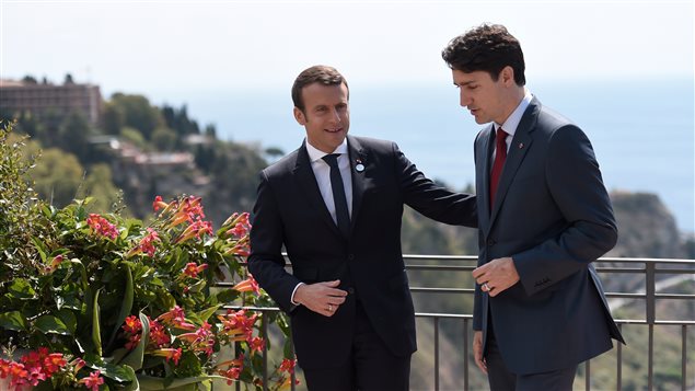 Canadian Prime Minister Justin Trudeau (R) and French President Emmanuel Macron talk as they attend the G7 Summit Taormina, Sicily, Italy, May 26, 2017.