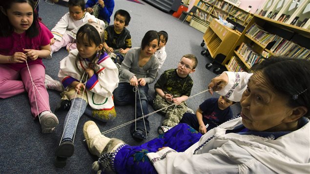Elder teacher Siipa Isullatak teaches children how to sew at the Nakasuk Elementary School in Iqaluit, Nunavut on Wednesday, April 1, 2009. In Canada’s 2011 census data on Aboriginal languages, Inuit dialects came in second among the top-three reported Aboriginal language families with 35,500 people.