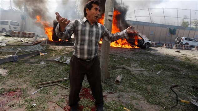 An Afghan man reacts at the site of a blast in Kabul, Afghanistan May 31, 2017.