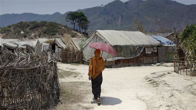 A Rohingya woman walks at the Kyein Ni Pyin camp for internally displaced people in Pauk Taw, Rakhine state, April 23, 2014