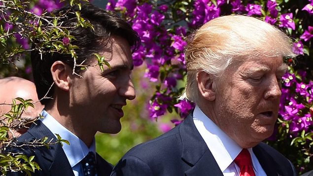 Prime Minister Justin Trudeau and U.S. President Donald Trump walk together during the G7 Summit in Taormina, Italy on Saturday, May 27, 2017.