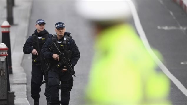 Armed police officers patrol London Bridge following this weekend’s terror attack in the U.K. Seven people were killed and at least 48 injured. 