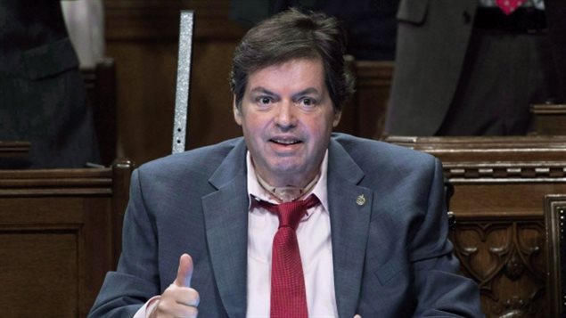 Former Ottawa-Vanier MP Mauril Bélanger is pictured in May 2016, as he received applause in the House of Commons after defending his proposed changes to O Canada. Belanger died last August. 