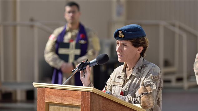 Brigadier-General Lise Bourgon, Commander Joint Task Force - Iraq, addresses the Remembrance Day parade in Kuwait on November 11, 2015 during Operation IMPACT.