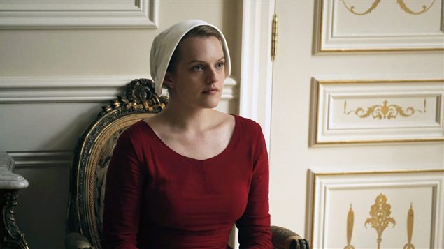 This image released by Hulu shows actress Elisabeth Moss as Offred in a scene from, *The Handmaid’s Tale,* a TV series based on Margaret Atwood’s eponymous novel.