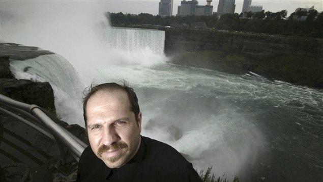 FILE- In this Aug. 13, 2004, file photo, Kirk Jones poses for a photo at Terrapin Point on the American side of Horseshoe Falls in Niagara Falls State Park, N.Y. Jones, who survived a plunge over Niagara Falls without protection in 2003 has died after he went over again, this time inside an inflatable ball.