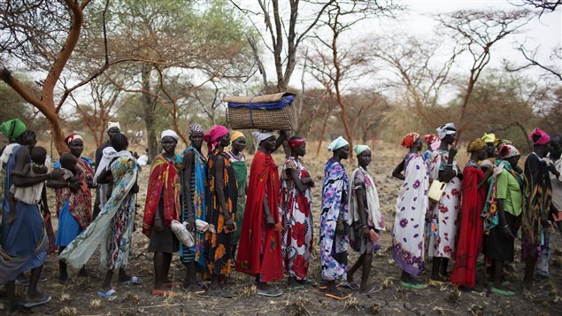 Women are screened for malnutrition at a joint UNICEF-WFP Rapid Response Mission (RRM), which delivers critical supplies and services to those displaced by conflict, in Nyanapol, northern Jonglei, March 3, 2015.