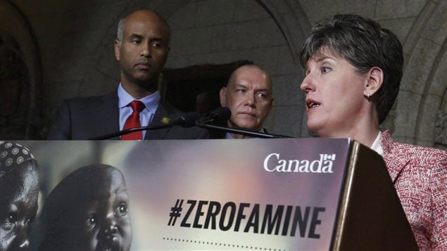 Minister of international Development Marie-Claude Bibeau (right) talks with reporters as Minister of Immigration , Refugees and Immigration Ahmed Hussen (left) and President of Red Cross Canada Conrad Sauve (centre) look on in Ottawa, Monday, May 29, 2017.