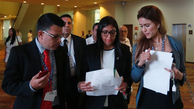 Venezuelan Foreign Minister Delcy Rodriguez (C) checks some documents with the delegation after a meeting with foreign ministers ahead of the OAS 47th General Assembly in Cancun, Mexico, June 19, 2017.