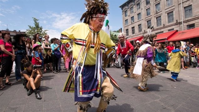 Mohawk Sonny Diabo, from Kahnawake, a reserve near Montreal, performs a smoke dance in Old Montreal as part of National Aboriginal Day, Friday, June 21, 2013, in Montreal. 