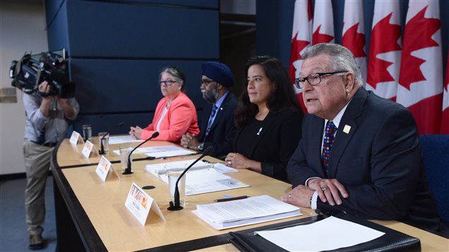 Public Safety Minister Ralph Goodale (right) and other cabinet ministers present new legislation to amend the controversial anti-terrorism law.