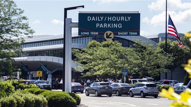 Travellers and traffic sit outside a terminal at Bishop International Airport, Wednesday morning, June 21, 2017, in Flint, Mich.