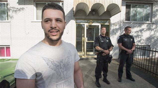 Mohcine Asrii, neighbour of stabbing suspect Amor Ftouhi, stands in front of his apartment building in Montreal, Wednesday, June 21, 2017. U.S. law enforcement authorities say a man allegedly involved in the stabbing of a police officer at a Michigan airport is a Canadian resident.