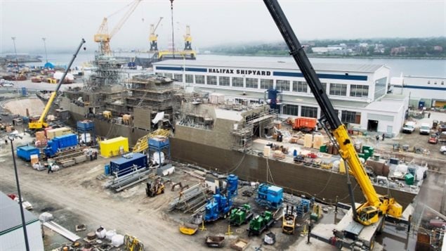 Arctic patrol vessel under construction in 2014. The first is set to be delievered in 2018. Unionized Dept of National Defence (DND) workers are expressing security and cost concerns over contracting maintenance to a private firm.