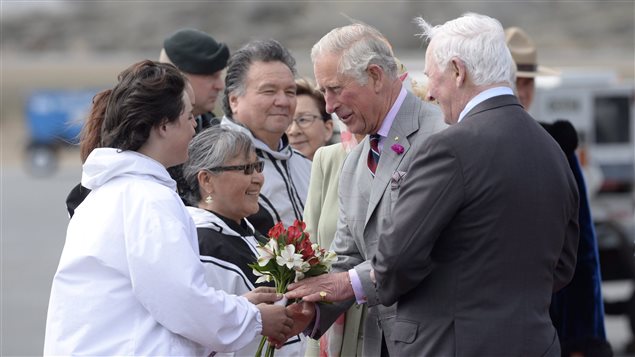Canadian Governor General David Johnston (right) and others greet Prince Charles as he arrives at the airport in Iqaluit, Nunavut, Thursday June 29, 2017. 