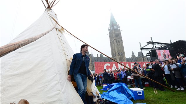 Prime Minister Justin Trudeau leaves a teepee on Parliament Hill in Ottawa on Friday, June 30, 2017. Trudeau had a brief meeting this morning with indigenous activists who have set up a demonstration teepee on Parliament Hill ahead of Canada Day celebrations. 