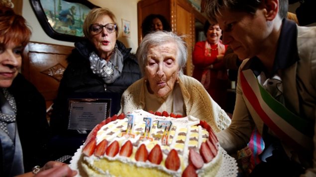 Emma Morano, thought to be the world’s oldest person and the last to be born in the 1800s, blows out candles during her 117th birthday in Verbania, northern Italy, Nov. 29, 2016.  She passed away in 2017.