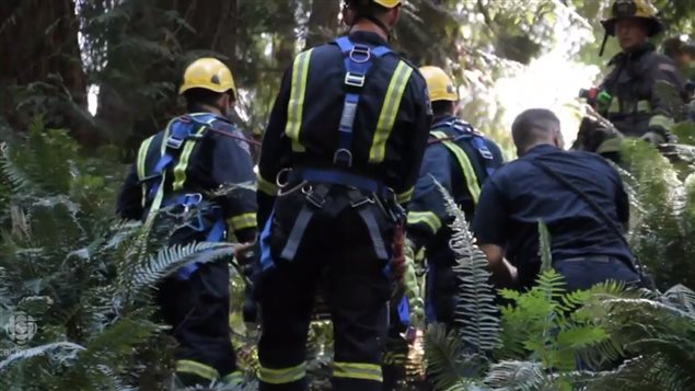 Rescue crews moved into a ravine in Surrey, B.C. to help a woman who had been trapped there for days.