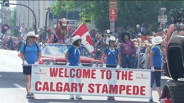 Many thousands of people lined up on Friday for the event opening Calgary Stampede parade in downtown Calgary 