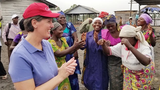 International Development Minister Marie-Claude Bibeau interacts with local women during her recent trip to the Democratic Republic of Congo.
