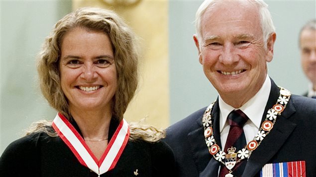 Canadian astronaut Julie Payette of Montreal stands with Governor General David Johnston after she was invested into the Order of Canada as Officer during a ceremony at Rideau Hall in Ottawa, Friday September 16 2011.